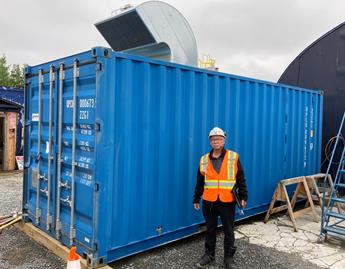 Shipping container with air compressor exterior solution